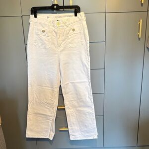 You will love these white jeans with gold buttons! In excellent condition